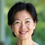 Portrait of Sarah Chen, a calm and experienced meditation instructor